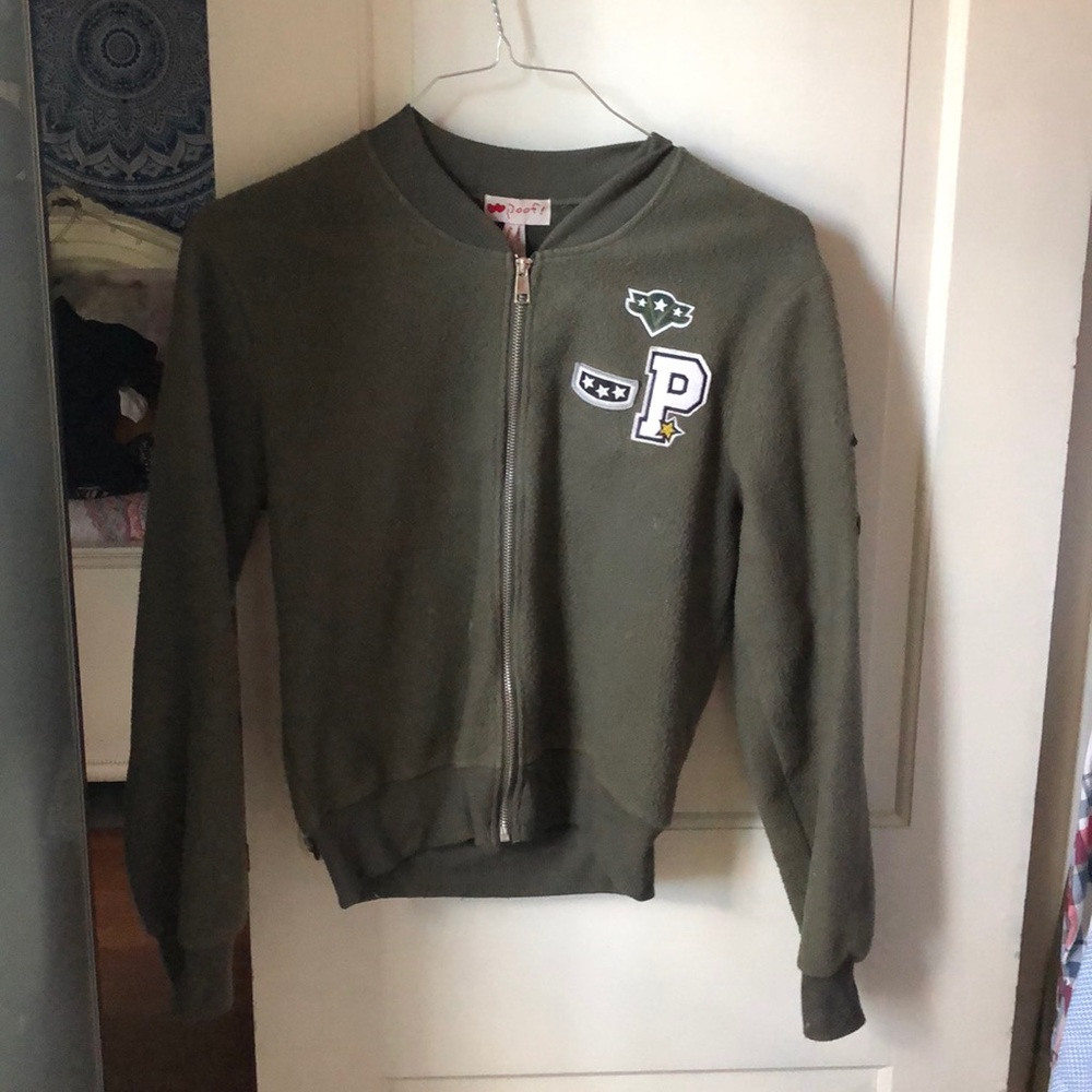 Green army jacket, patches in the front and arm